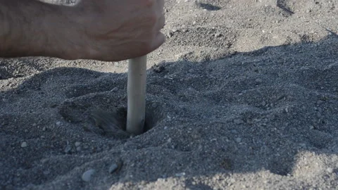 Man digging with a stick Stock Footage 114129394