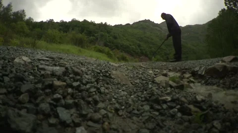 Man digging stones Stock Footage 46499919