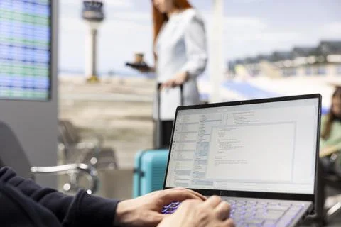 Man digital nomad, focused on programming, system development on laptop Stock Photos