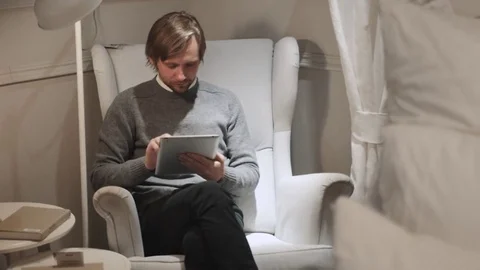 Man with digital tablet. Confident young handsome man holding digital tablet and Video stock 72025161