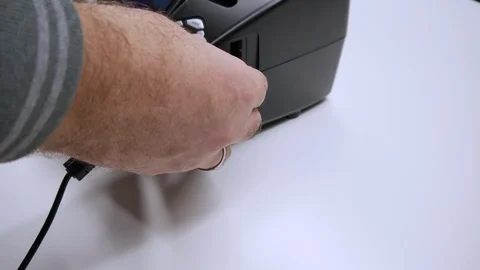 A man digitizes a camera film on a device Video stock 99706265