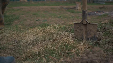 A man digs the ground with a shovel Video stock 88997132