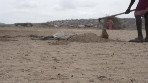 Man digs a hole in the ground in slow motion. Stock Footage 319338700
