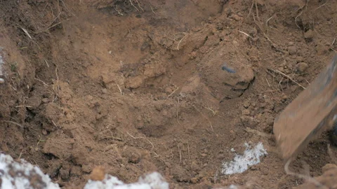 Man digs optic cable connection Stock Footage 99898190