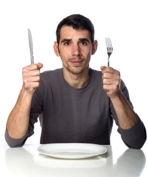 Man at dinner table isolated over white Foto stock