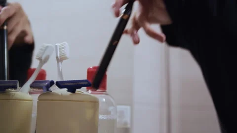 Man with Disability Brushing Teeth at Home Bathroom Mirror 스톡 동영상 321942192