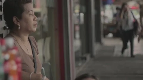 A man with disability eating while watching his store Stock Footage 230088281