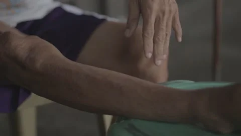 A man with disability eating while watching his store Stock Footage 230088288