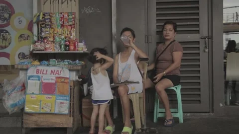A man with disability eating while watching his store Stock Footage 230088314