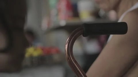 A man with disability eating while watching his store Stock Footage 230088366