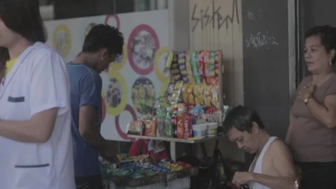 A man with disability eating while watching his store Stock Footage 230089369
