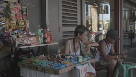 A man with disability eating while watching his store Stock Footage 230089799