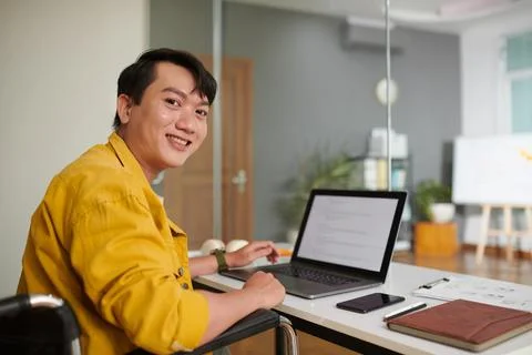 Man with Disability Working on Computer Foto stock