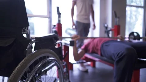 Man with a disability working out at the gym Stock Footage 249669659