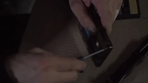 A man disassembles an audio tape Stock Footage 131564513