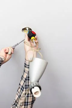 Man disassembles defected ceiling lamp Foto stock