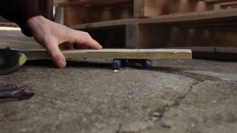 A man disassembles a pallet Stock Footage 152232456