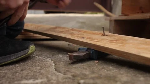 A man disassembles a pallet Stock Footage 152232559