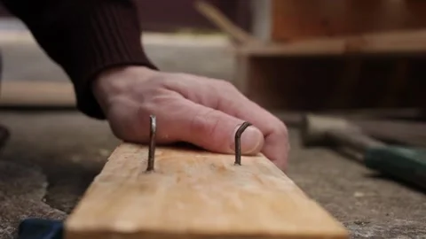 A man disassembles a pallet Stock Footage 152232588