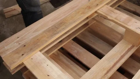 A man disassembles a pallet Video stock 152232614