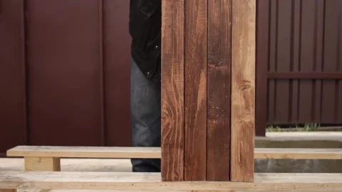 A man disassembles a pallet Stock Footage 152232793