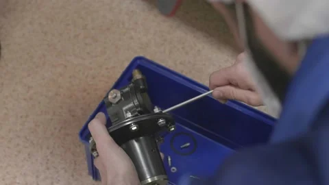 Man disassembles the production part on the components, unscrews the screws Stock Footage 147255022