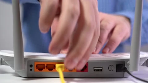 Man Disconnects Lan Cable from Router. Router Wireless. Close-up Stock Footage 157535456