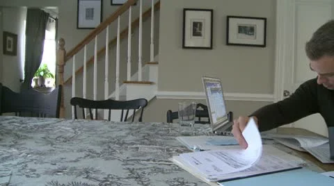 A man is discouraged going over his finances (1 of 4) Stock Footage 10565030