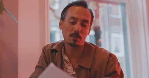 Man discussing matter over papers Stock Footage 203583271