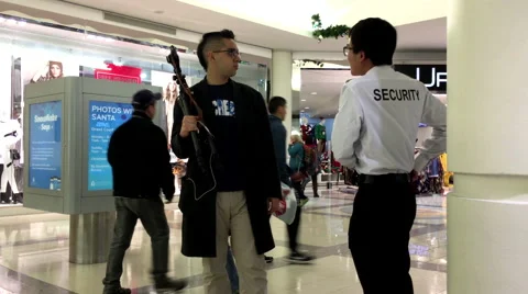 Man discussing with security about taking picture Stock Footage 58716748