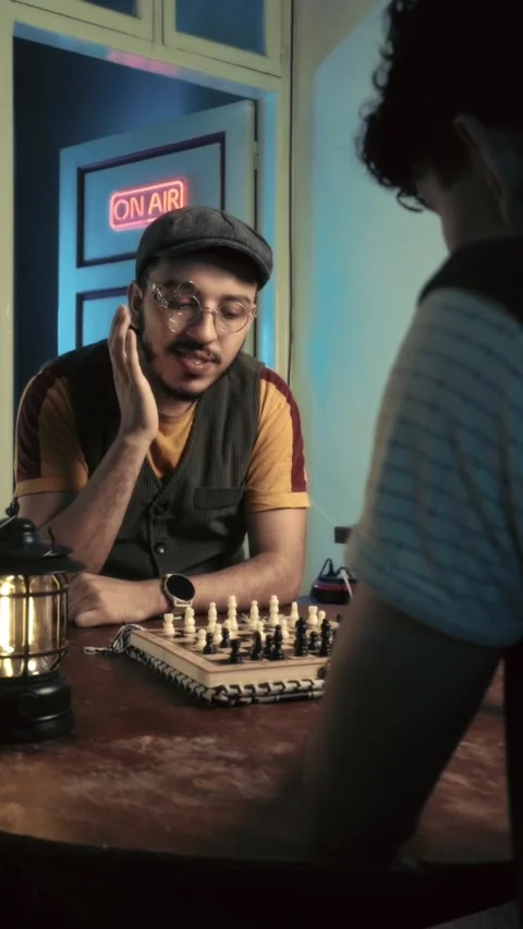 Man Discussing Strategy During Chess Game in Retro Studio Video stock 321679784