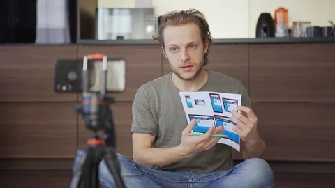 Man discussing web interface template during video call Stock Footage 128574362