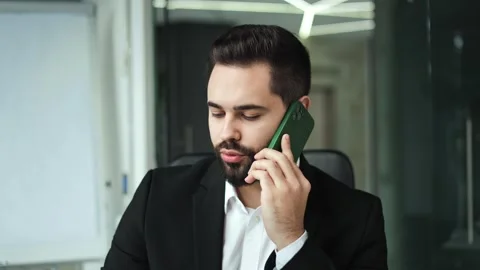 Man discussing work issues during business conversation on modern smartphone Stock-Footage 258639985