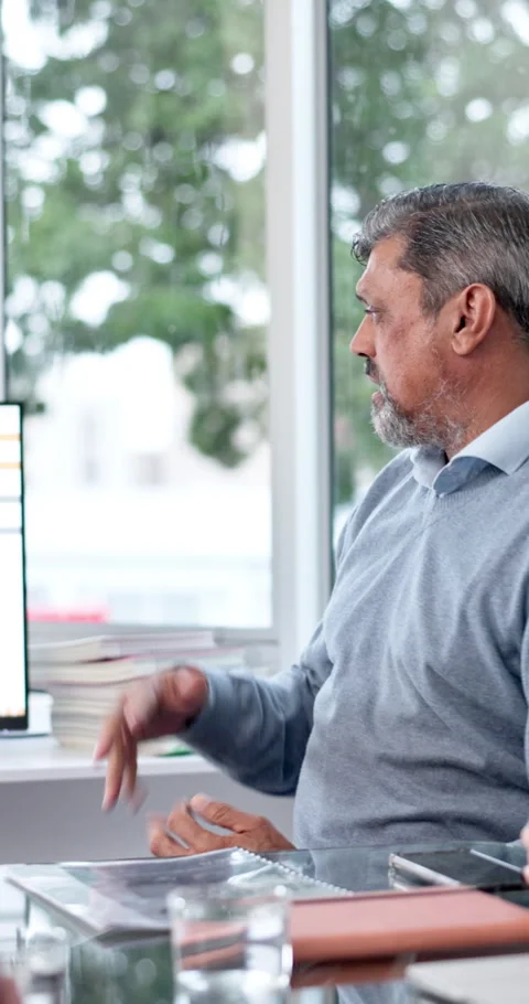 Man, discussion and presentation in office with screen, demographic stats and Stock Footage 337025746