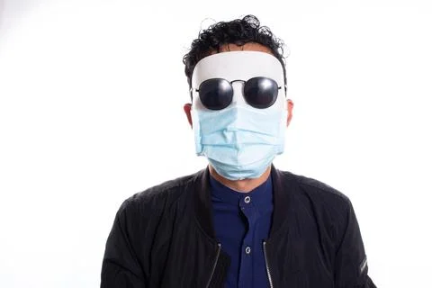 Man in disguise without expression and with face mask of a doctor. White Stock Photos
