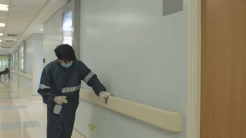 Man Disinfecting Handrails To Avoid The Spread Of Coronavirus Inside The Stock Footage 142522235