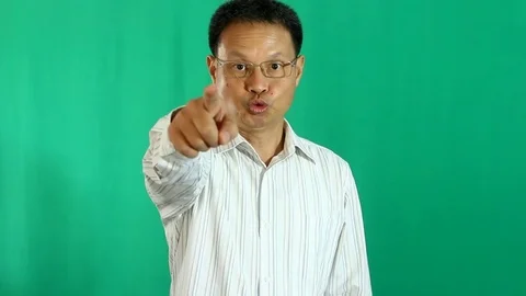 Man dismissing with green background Stock Footage 83375895