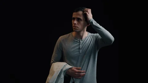 Man disoriented in engulfing darkness seeks right way Stock Footage 312477427