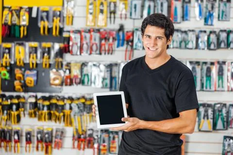 Man Displaying Digital Tablet In Hardware Store Stock Photos