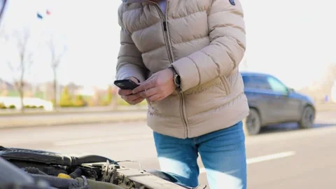 A man in distress, using his mobile device to call Stock Footage 234690471