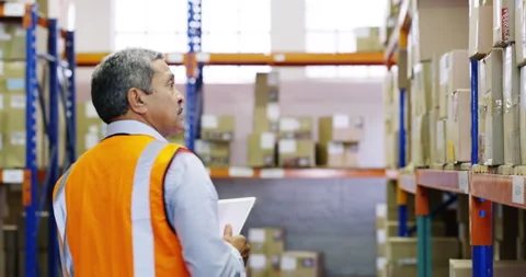 Man, distribution and tablet in warehouse with counting for stocktaking, boxes Stock Footage 345802325