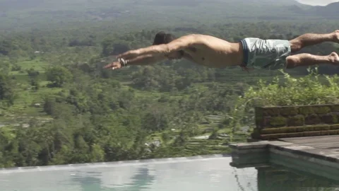 Man Dives into Infinity Pool in Slow Motion Stock Footage 106151679