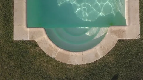 Man dives into the pool, aerial drone view Video stock 102032452