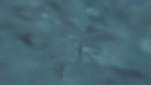 A man dives into the pool and lets bubbles Stock Footage 163480131