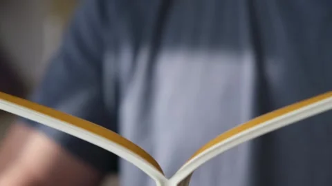 A man divides rubber tape into two strips to glue sealing rubber tape to the Stock Footage 235676342