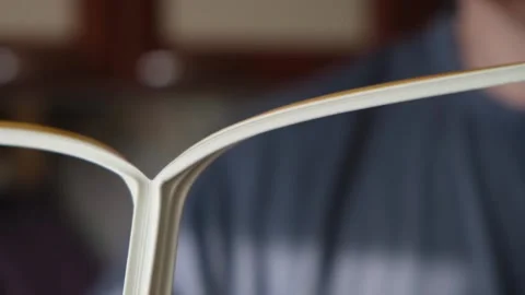 A man divides rubber tape into two strips to glue sealing rubber tape to the Stock Footage 235913275