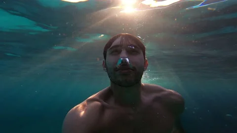 A man diving in the clear sea. Stock Footage 149518477