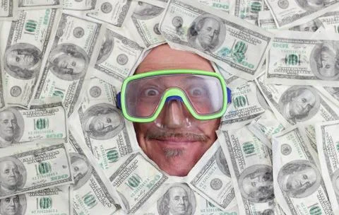 Man diving in dollar notes Stock-Fotos