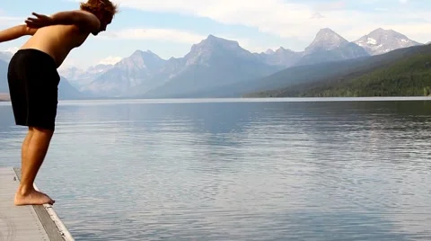 Man diving into lake 1 Stock Footage 1066874
