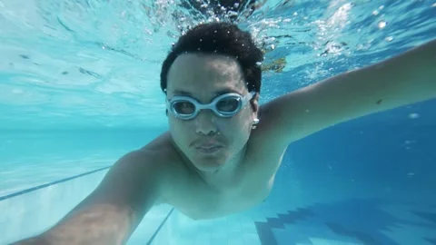 Man Diving Underwater Swimming in Pool with Goggles, Summer Vacation Stock Footage 338314950